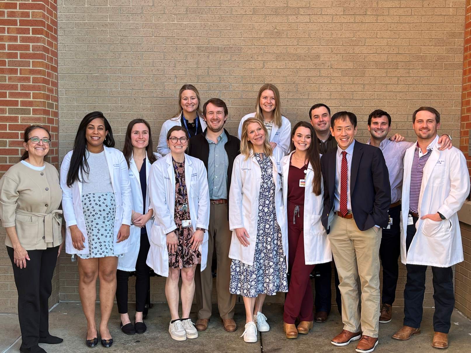 Drs. Sandy and Hensin Tsao, February Grand Rounds speakers, pictured with our residents.